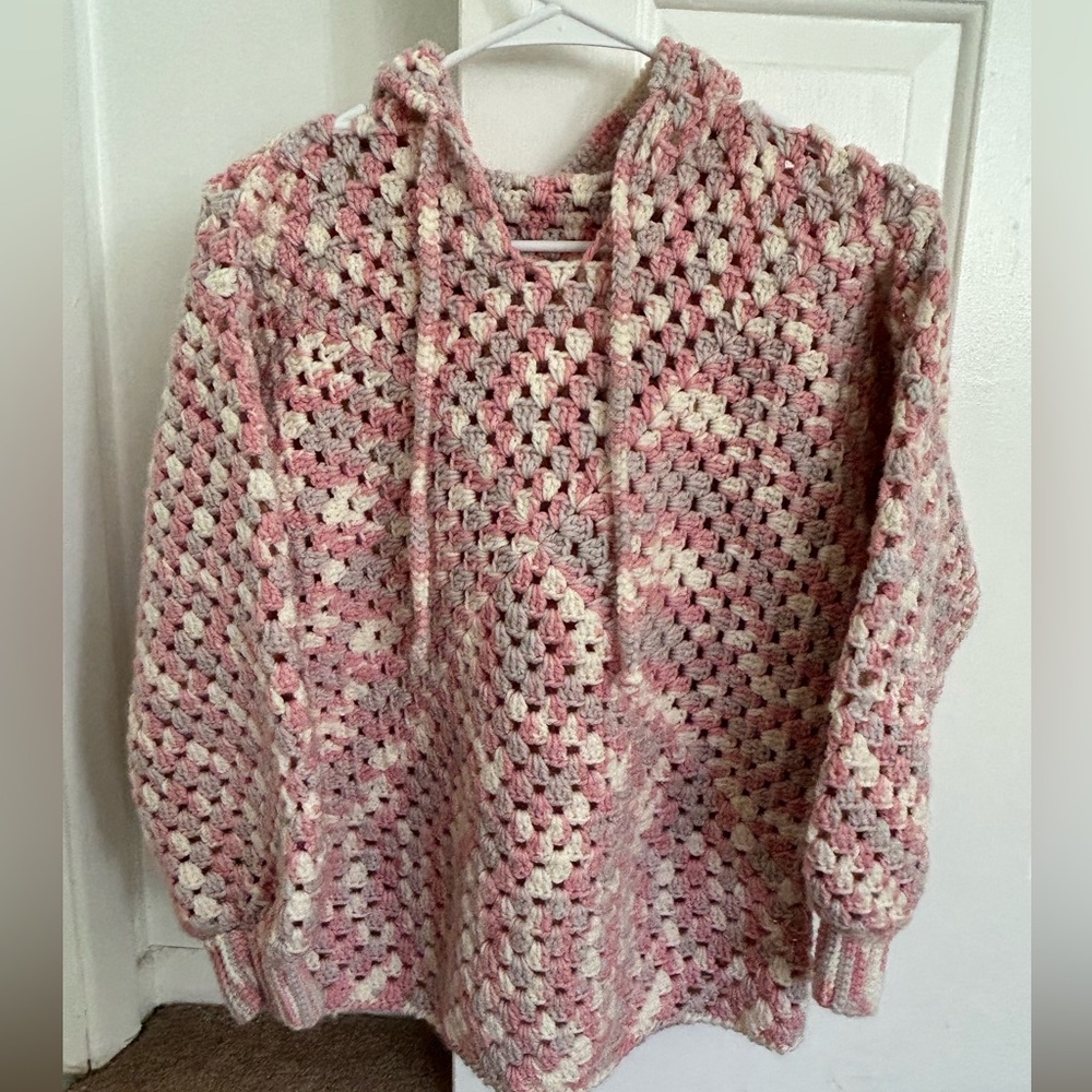 Nice and warm hand-knitted hooded jacket.